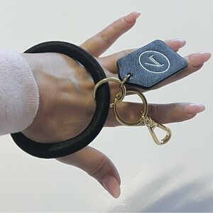 Boulevard Keychain wristlet, black and gold tone carabin closure